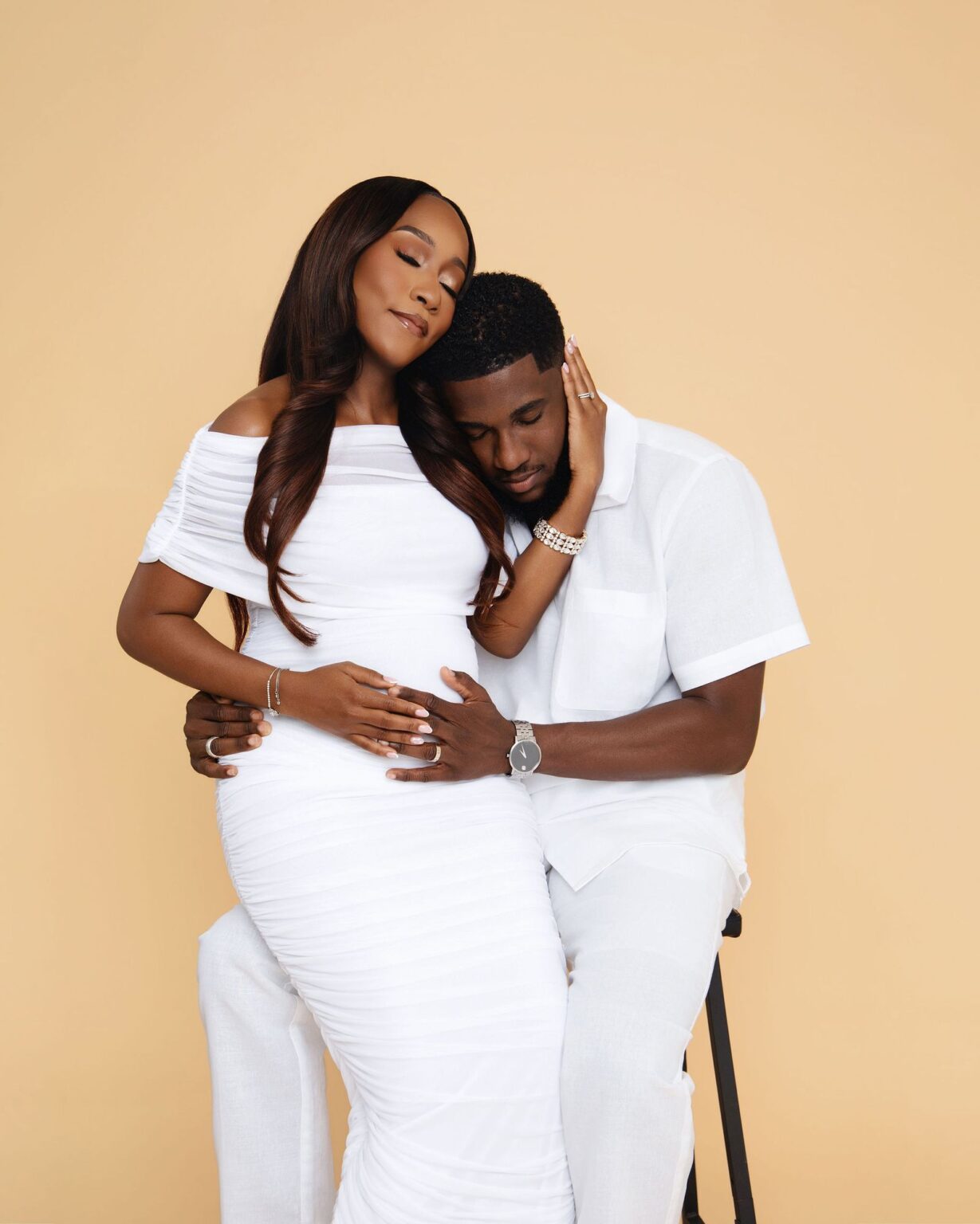 Expecting couple embracing