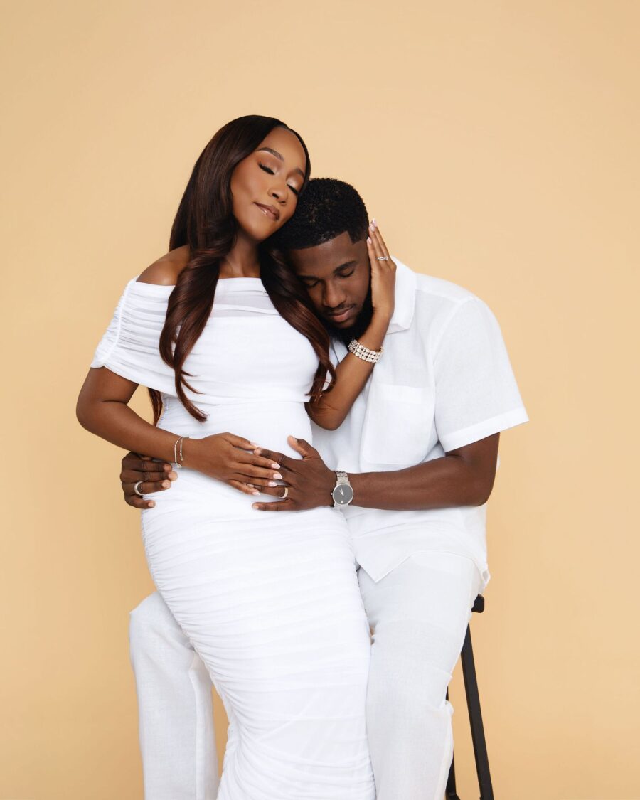 Expecting couple embracing
